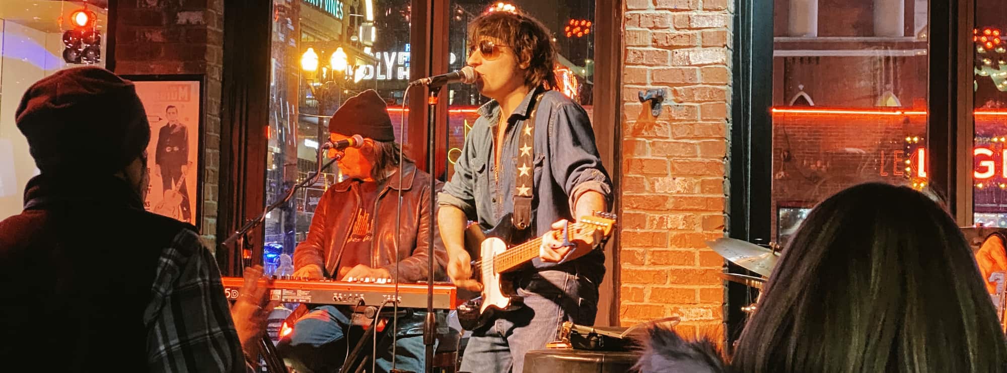 bar singer on guitar in New Orleans